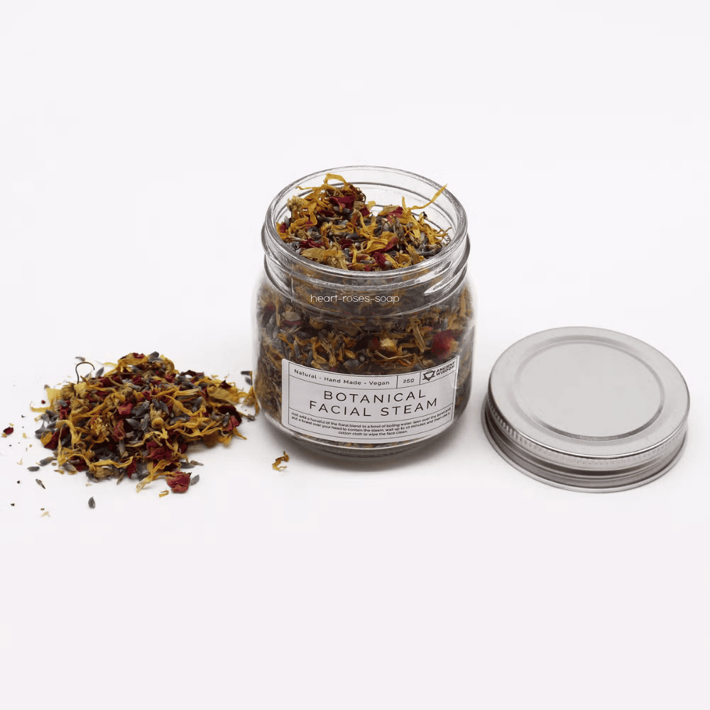 Jar of botanical facial steam mix with a label on a white background