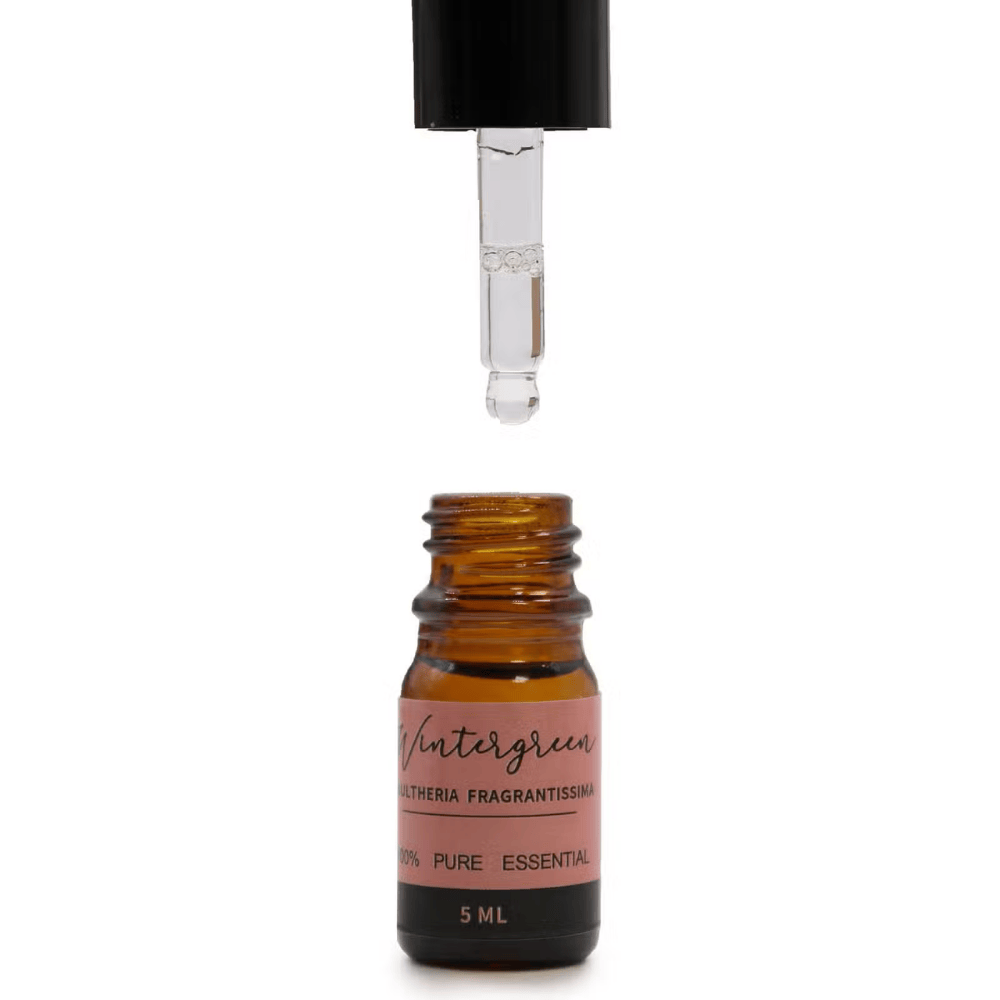 Amber glass essential oil bottle with dropper on a white background