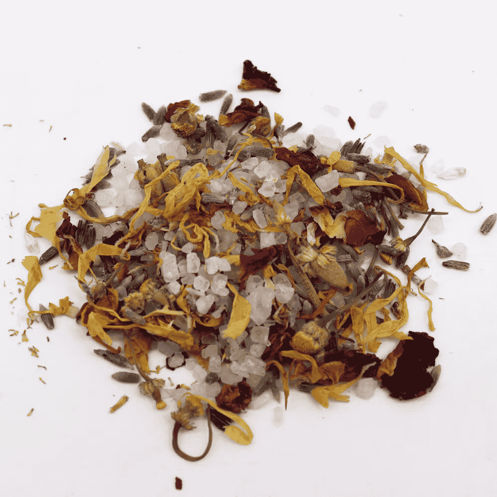 Mixture of dried flowers and herbs on a white background
