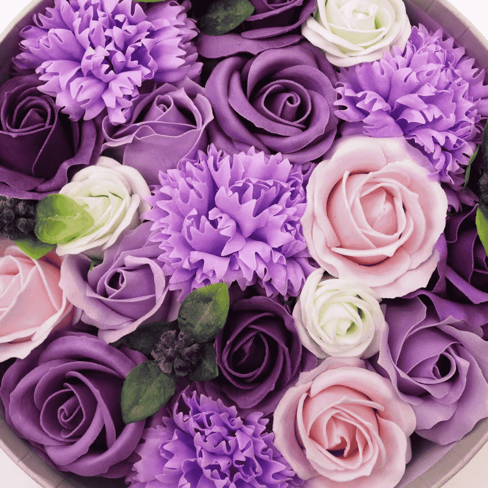 Assorted purple, pink, and white soap flowers in a circular arrangement.