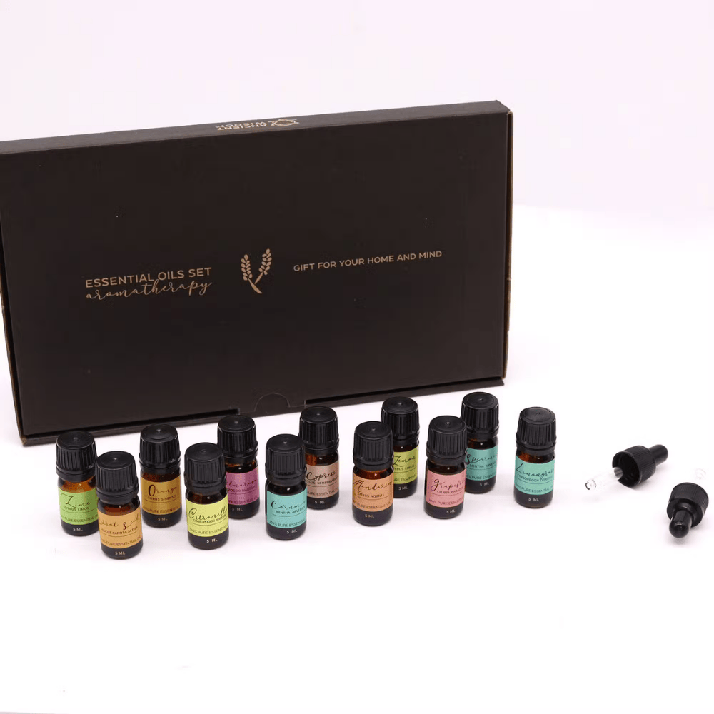 Essential oils set with black box labeled 'Essential Oils Set Aromatherapy' on a white background.